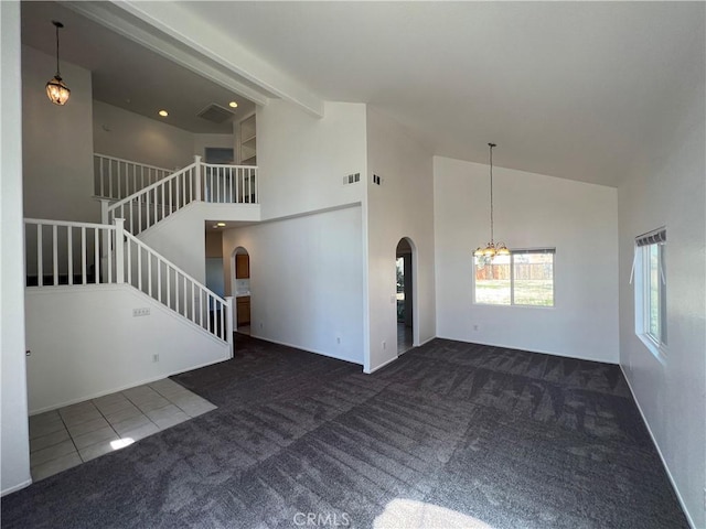 12418 Firefly Way, Victorville, CA 92392 - unfurnished living room featuring arched walkways, high vaulted ceiling, carpet, stairs, and a chandelier