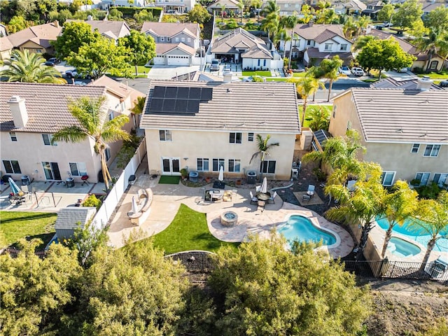 aerial perspective of suburban area featuring a pool