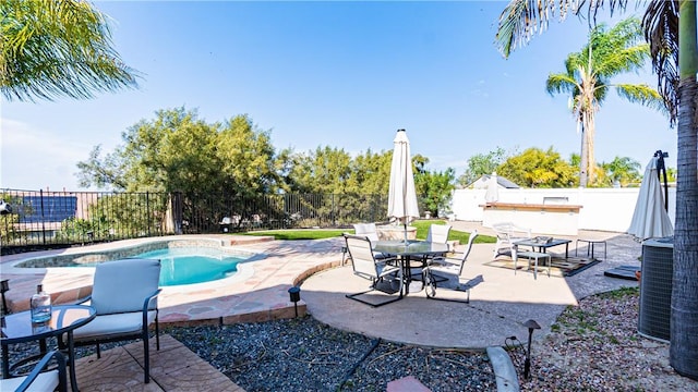 view of swimming pool featuring a fenced backyard, a patio area, and central AC
