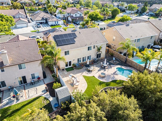 aerial perspective of suburban area featuring a pool
