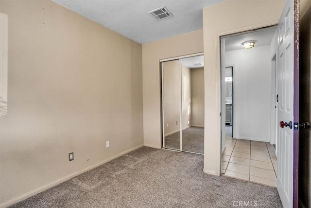 7565 Sherman Hoyt Ave Unit 29, Palms, CA 92277 - unfurnished bedroom featuring carpet flooring, a closet, and baseboards