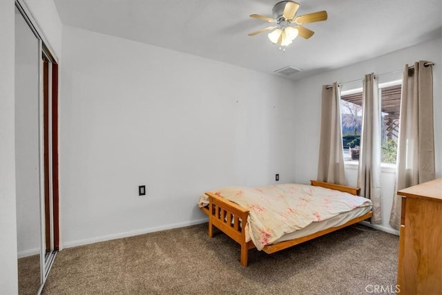 7565 Sherman Hoyt Ave Unit 29, Palms, CA 92277 - bedroom featuring carpet floors, baseboards, a ceiling fan, and a closet