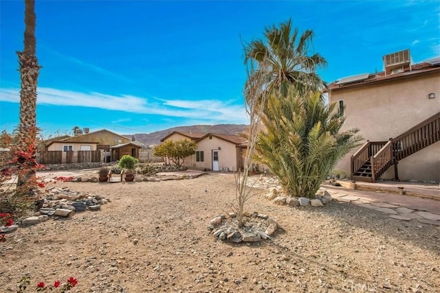 7565 Sherman Hoyt Ave Unit 29, Palms, CA 92277 - view of front of property with stairs and stucco siding