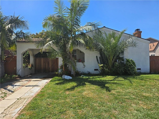 519 N Sloan Ave, Compton, CA 90221 - view of home's exterior featuring stucco siding, a chimney, concrete driveway, and crawl space