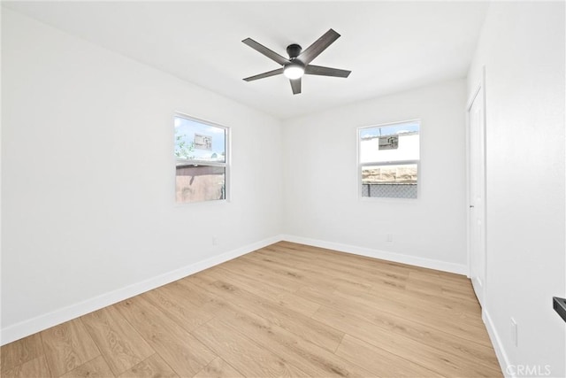 9613 Wilmington Ave, Los Angeles, CA 90002 - spare room featuring light wood-type flooring, ceiling fan, and baseboards