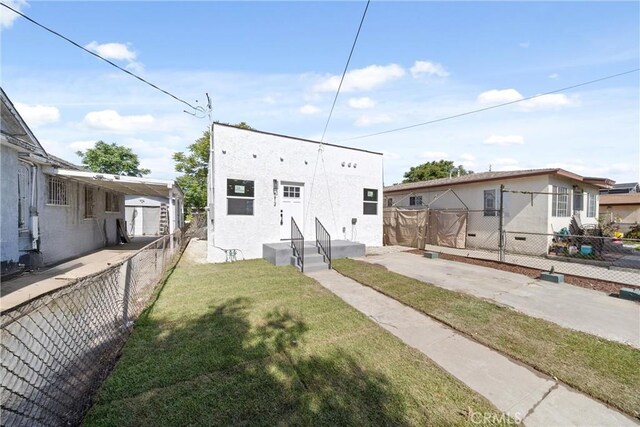 9613 Wilmington Ave, Los Angeles, CA 90002 - rear view of house with stucco siding