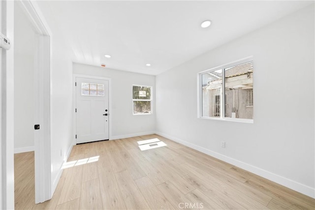 9613 Wilmington Ave, Los Angeles, CA 90002 - entryway with light wood-style flooring, baseboards, and recessed lighting