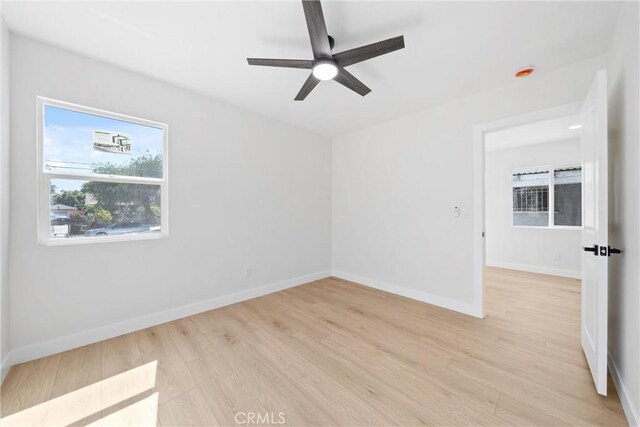 9613 Wilmington Ave, Los Angeles, CA 90002 - empty room featuring light wood-type flooring, a ceiling fan, and baseboards