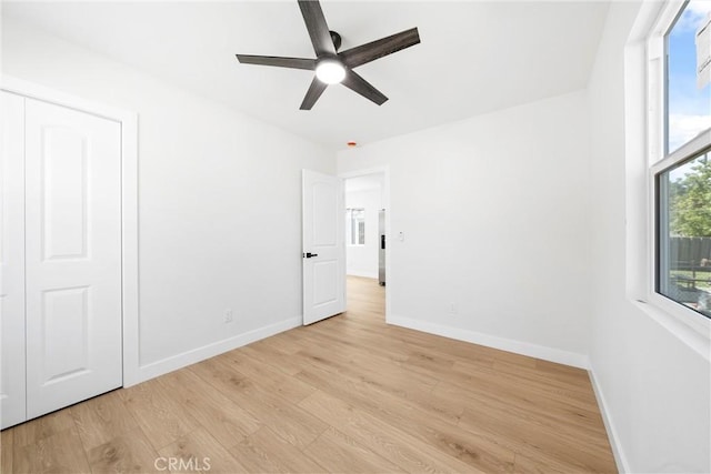 9613 Wilmington Ave, Los Angeles, CA 90002 - unfurnished room featuring light wood-style flooring, ceiling fan, and baseboards