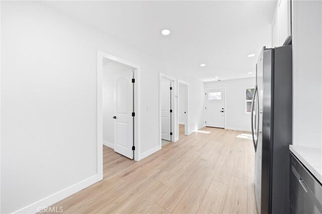 9613 Wilmington Ave, Los Angeles, CA 90002 - hallway with recessed lighting, light wood-style flooring, and baseboards