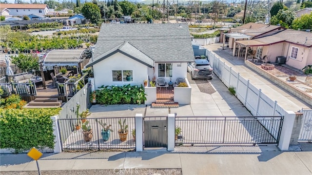 7938 Graves Ave, Rosemead, CA 91770 - view of front of property with a fenced front yard, roof with shingles, a gate, stucco siding, and a residential view