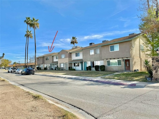 1060 N Lovekin Blvd Unit 2, Blythe, CA 92225 - view of front facade with a residential view and stucco siding