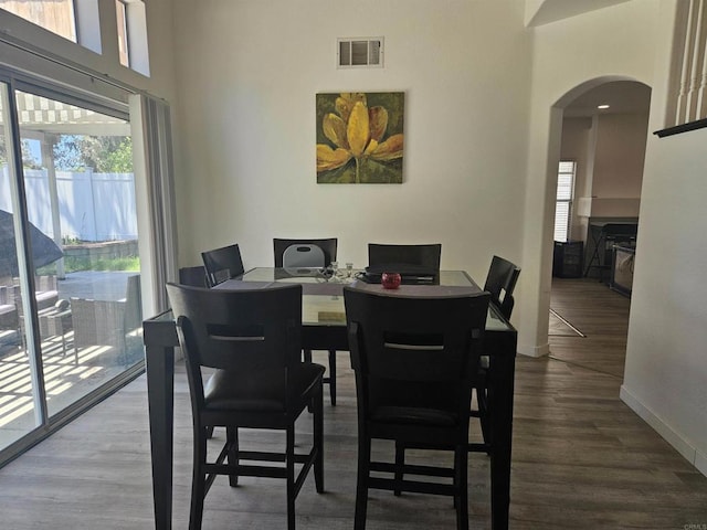 43075 Corte Fresca, Temecula, CA 92592 - dining room featuring arched walkways, plenty of natural light, and wood finished floors