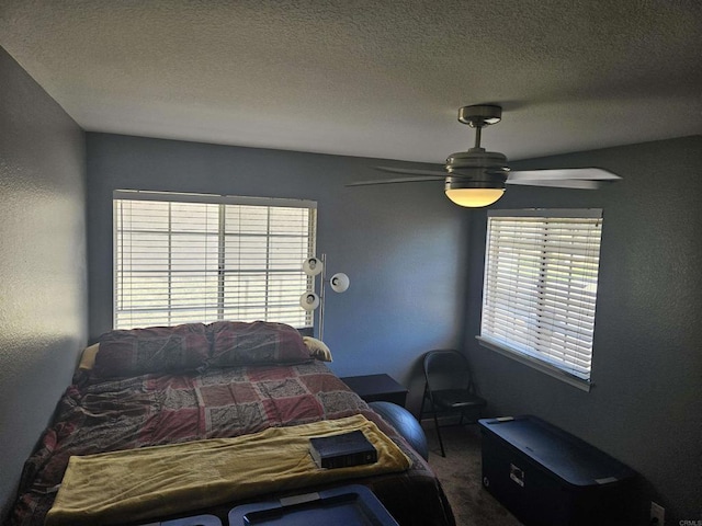 43075 Corte Fresca, Temecula, CA 92592 - bedroom featuring carpet, ceiling fan, and a textured ceiling