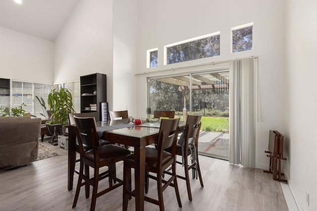 43075 Corte Fresca, Temecula, CA 92592 - dining area with a towering ceiling, wood finished floors, and plenty of natural light