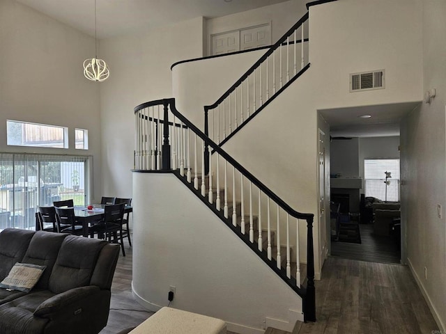 43075 Corte Fresca, Temecula, CA 92592 - stairway featuring a towering ceiling and wood finished floors