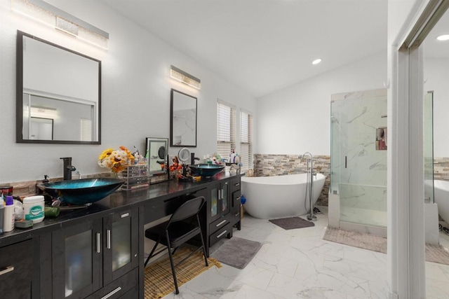 43075 Corte Fresca, Temecula, CA 92592 - bathroom with marble look tiles, double vanity, a freestanding bath, a marble finish shower, and lofted ceiling