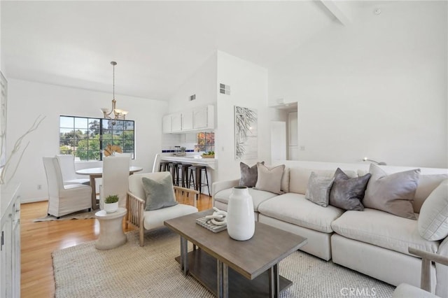 1924 Mathews Ave Unit B, Redondo Beach, CA 90278 - living area featuring a chandelier, light wood finished floors, beam ceiling, high vaulted ceiling, and baseboards