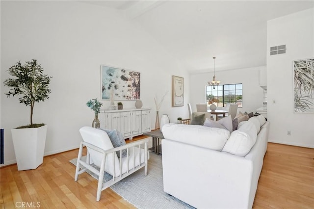 1924 Mathews Ave Unit B, Redondo Beach, CA 90278 - living room featuring light wood-style floors, a chandelier, beamed ceiling, high vaulted ceiling, and baseboards