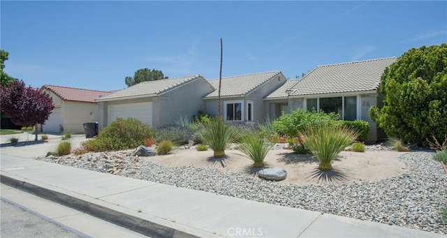 5538 Katrina Pl, Palmdale, CA 93552 - single story home with a tiled roof, a garage, and stucco siding