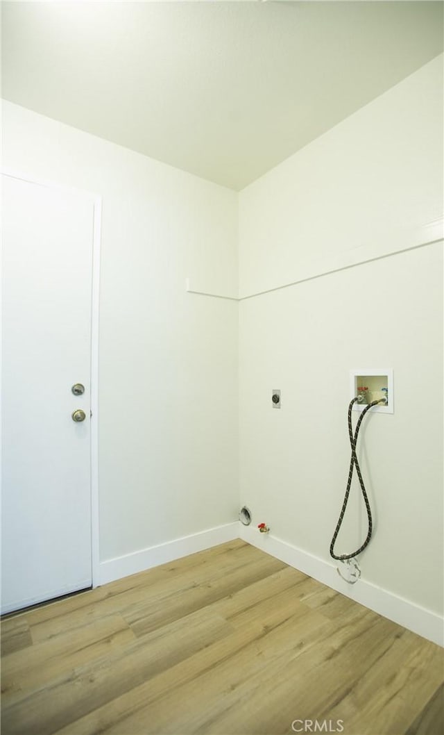 5538 Katrina Pl, Palmdale, CA 93552 - washroom featuring gas dryer hookup, light wood-type flooring, washer hookup, and baseboards