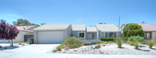 5538 Katrina Pl, Palmdale, CA 93552 - ranch-style home with a garage, a tiled roof, stucco siding, and concrete driveway