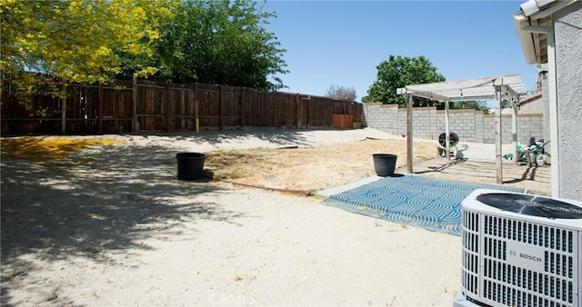 5538 Katrina Pl, Palmdale, CA 93552 - fenced backyard with central AC, a patio area, and a pergola
