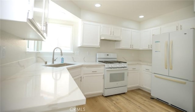 5538 Katrina Pl, Palmdale, CA 93552 - kitchen with white appliances, a sink, white cabinets, light wood-style floors, and recessed lighting