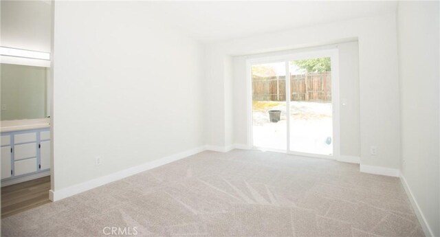 5538 Katrina Pl, Palmdale, CA 93552 - spare room featuring light carpet and baseboards