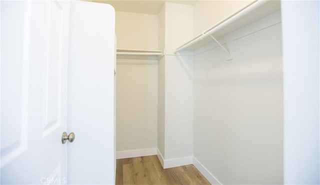 5538 Katrina Pl, Palmdale, CA 93552 - walk in closet featuring light wood-style floors