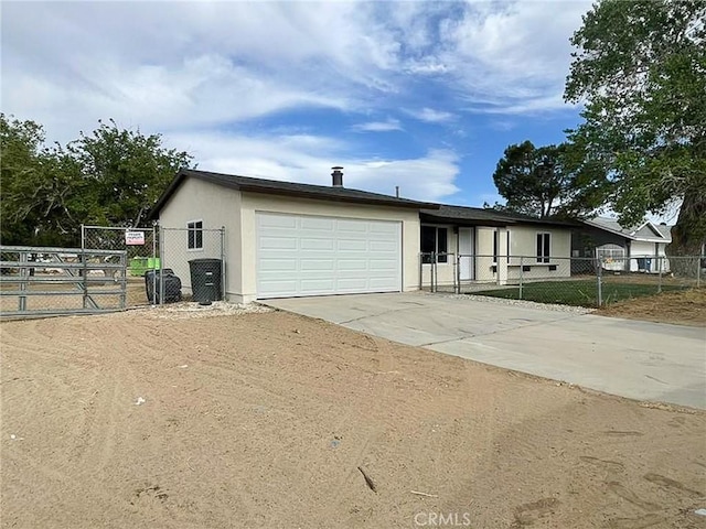 40294 Fieldspring St, Palmdale, CA 93591 - single story home with a garage, a gate, concrete driveway, and stucco siding
