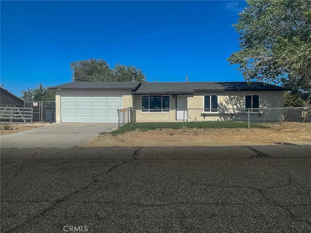 40294 Fieldspring St, Palmdale, CA 93591 - single story home with a garage, stucco siding, driveway, and a fenced front yard