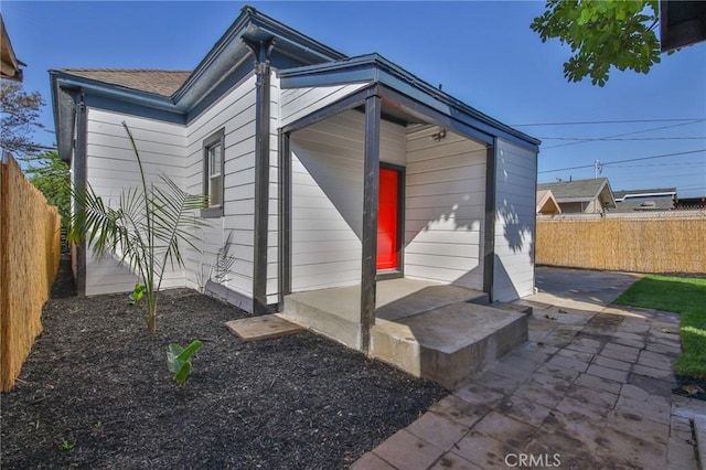 view of outbuilding featuring a fenced backyard