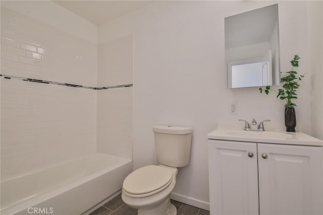 bathroom with toilet, vanity, baseboards, and  shower combination