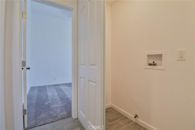 washroom featuring washer hookup and baseboards