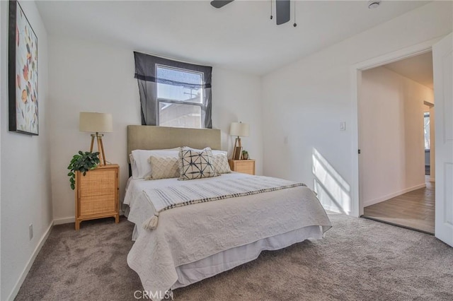 bedroom featuring carpet floors, a ceiling fan, and baseboards