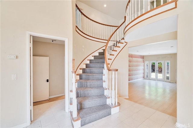 14807 Otsego St, Sherman Oaks, CA 91403 - staircase with a towering ceiling, baseboards, and french doors