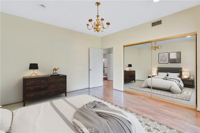 14807 Otsego St, Sherman Oaks, CA 91403 - bedroom with a chandelier, wood finished floors, a closet, and recessed lighting