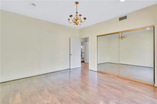 14807 Otsego St, Sherman Oaks, CA 91403 - unfurnished bedroom with a chandelier, wood finished floors, and a closet