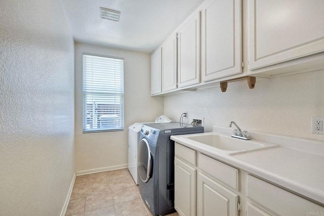 1752 Russet Leaf Ct, El Cajon, CA 92019 - laundry room with baseboards, separate washer and dryer, cabinet space, and light tile patterned floors