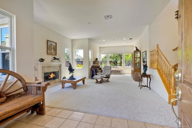 1752 Russet Leaf Ct, El Cajon, CA 92019 - living area with light carpet, a tiled fireplace, stairway, light tile patterned flooring, and recessed lighting