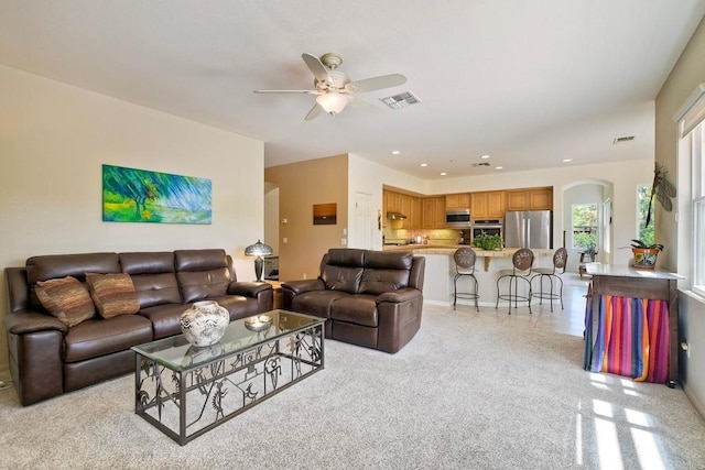 1752 Russet Leaf Ct, El Cajon, CA 92019 - living room featuring arched walkways, a ceiling fan, light colored carpet, and recessed lighting