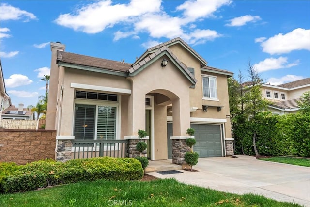 34274 Deergrass Way, Lake Elsinore, CA 92532 - view of front of property with stone siding, an attached garage, driveway, stucco siding, and a chimney