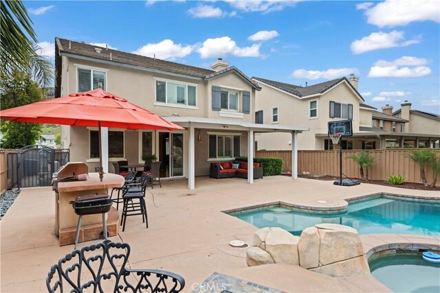 34274 Deergrass Way, Lake Elsinore, CA 92532 - view of pool featuring a fenced backyard, a patio, an outdoor hangout area, and an in-ground hot tub