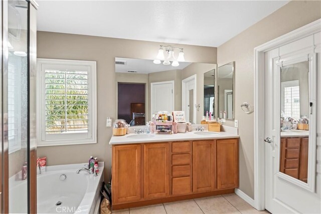 34274 Deergrass Way, Lake Elsinore, CA 92532 - full bath with ensuite bath, healthy amount of natural light, a chandelier, and double vanity