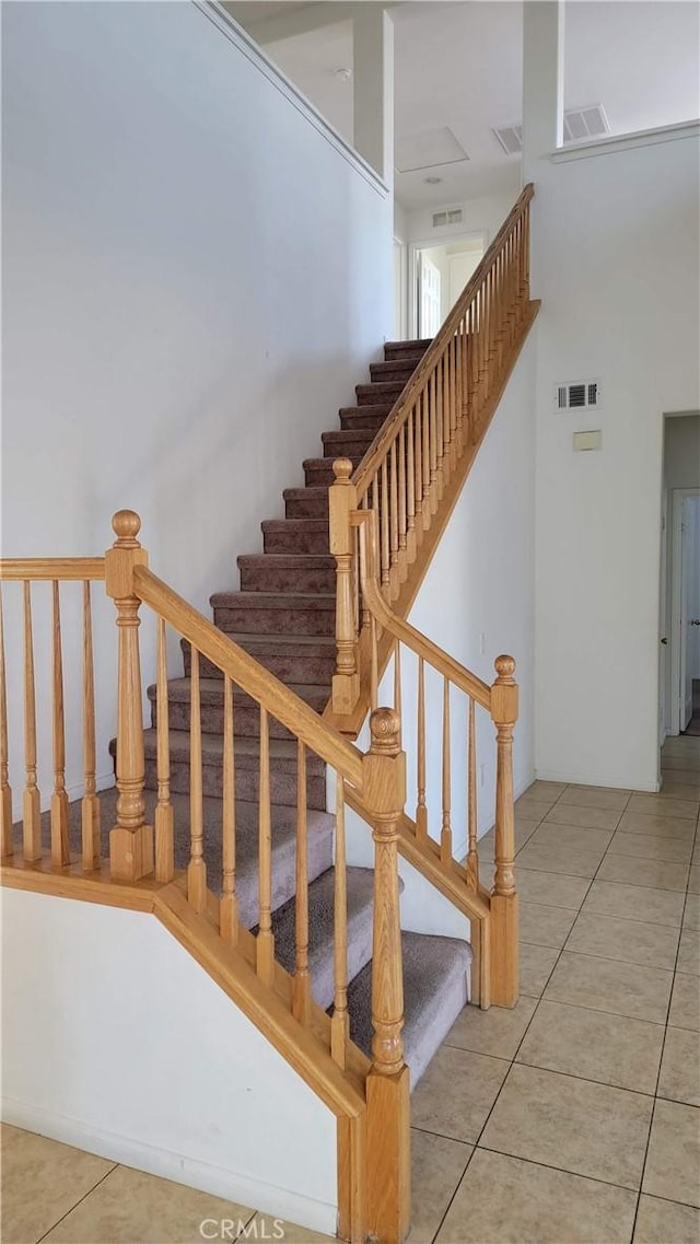 29746 Maxmillian Ave, Murrieta, CA 92563 - stairway featuring tile patterned flooring and a towering ceiling