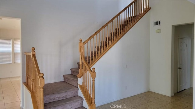 29746 Maxmillian Ave, Murrieta, CA 92563 - staircase with tile patterned floors and baseboards
