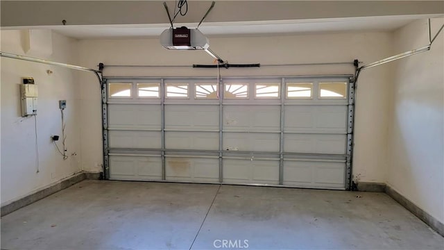 29746 Maxmillian Ave, Murrieta, CA 92563 - garage featuring baseboards and a garage door opener