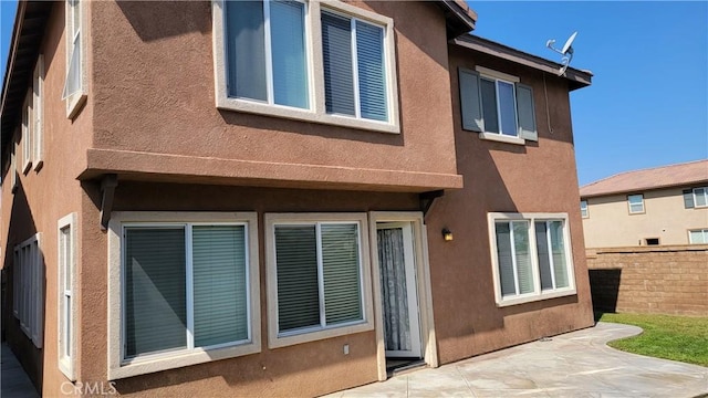 29746 Maxmillian Ave, Murrieta, CA 92563 - back of property featuring a patio area, fence, and stucco siding