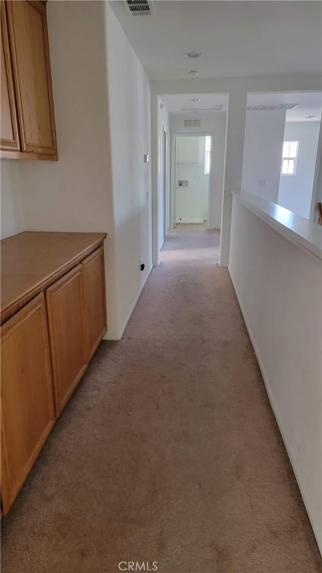 29746 Maxmillian Ave, Murrieta, CA 92563 - corridor with light carpet and healthy amount of natural light